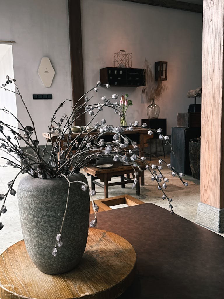 Elegant minimalist interior with vases and soft décor elements creating a calm atmosphere